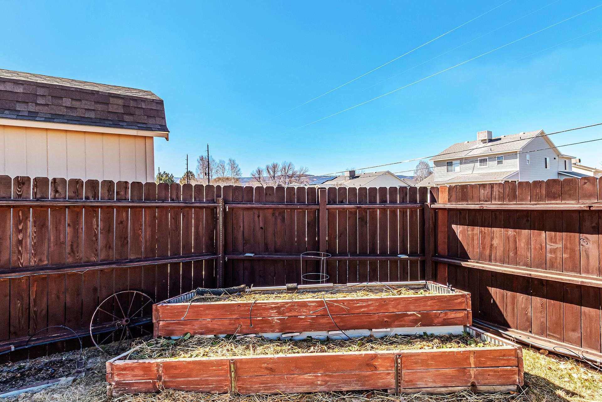 110 Sunset Drive Fruita, CO 81521 - Photo 38 of 39 a view of a backyard with a deck