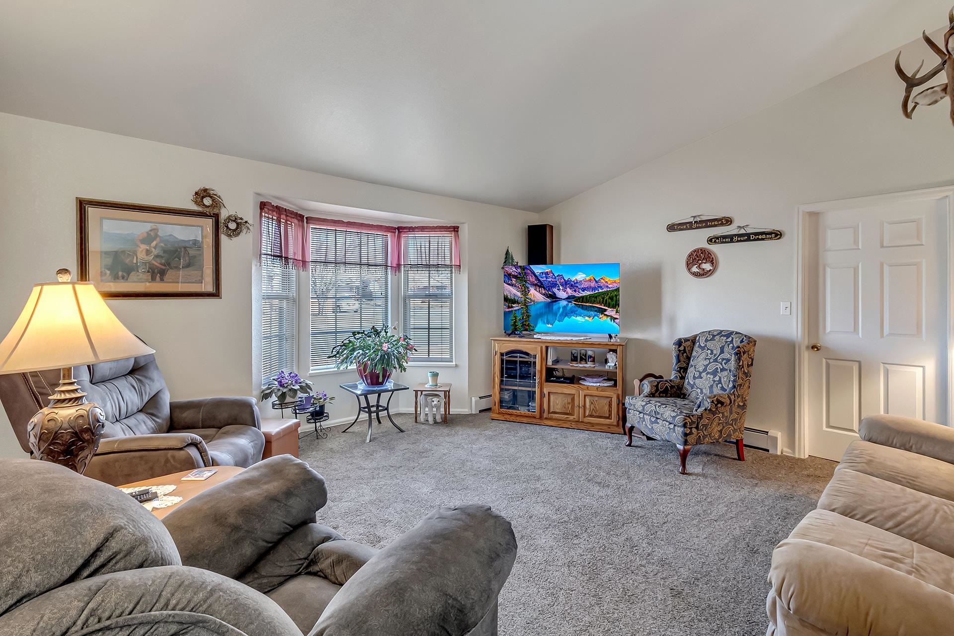 110 Sunset Drive Fruita, CO 81521 - Photo 7 of 39 a living room with furniture and a flat screen tv