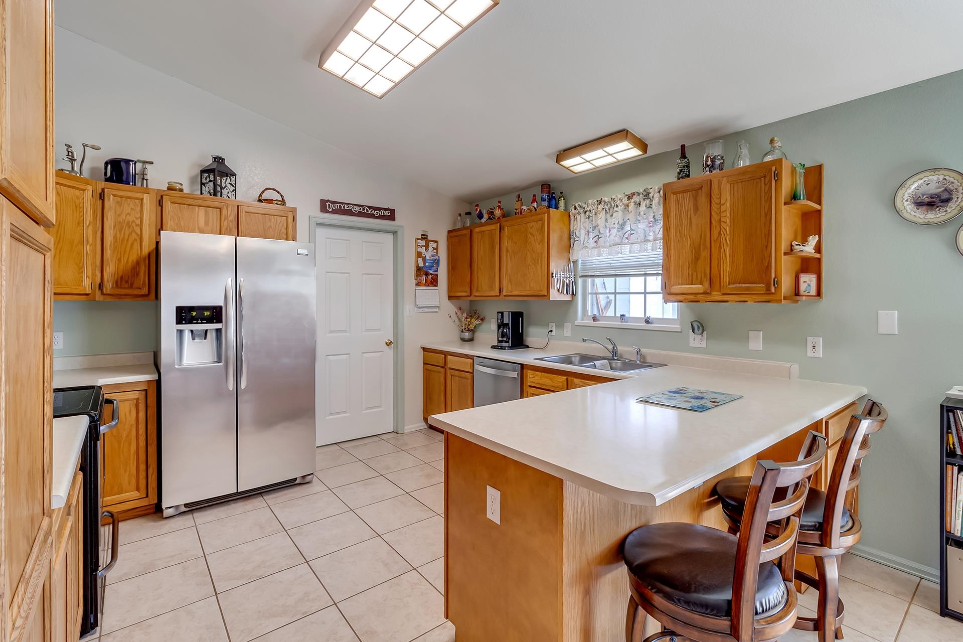 110 Sunset Drive Fruita, CO 81521 - Photo 10 of 39 a kitchen with stainless steel appliances a sink cabinets and a refrigerator