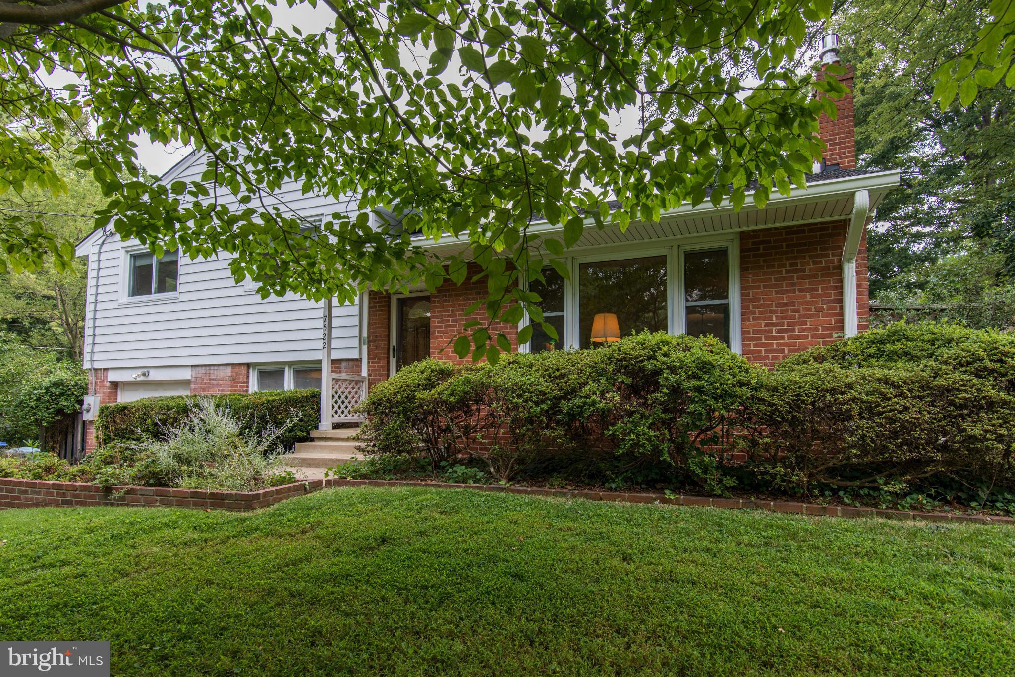 7522 Havelock Street Springfield, VA 22150 - Photo 2 of 30 a front view of a house with garden