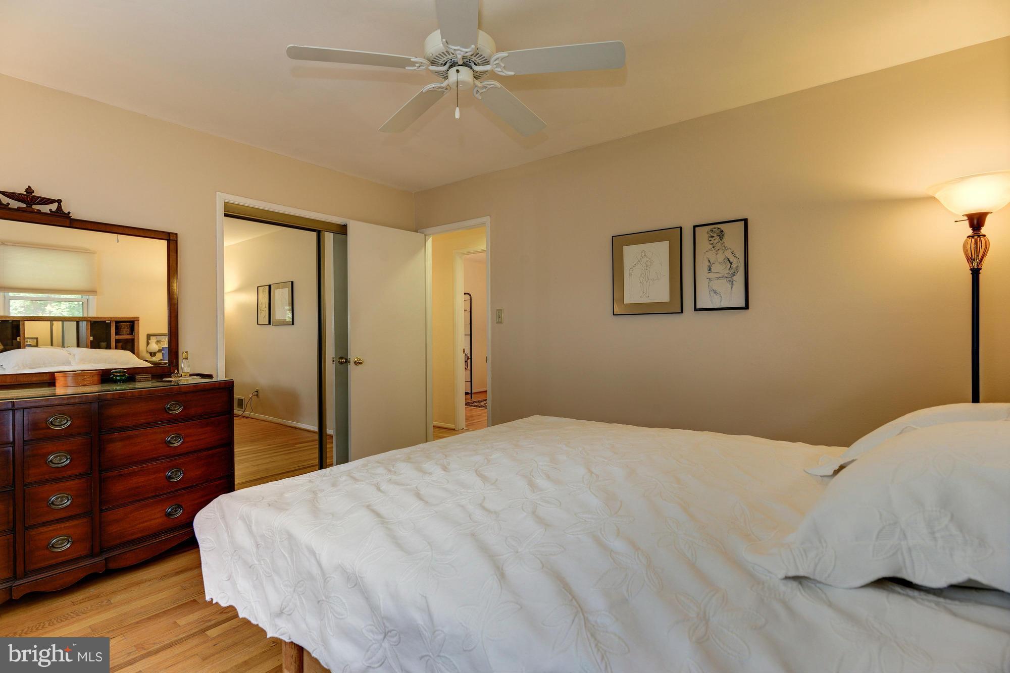 7522 Havelock Street Springfield, VA 22150 - Photo 16 of 30 a bedroom with a bed and a dresser