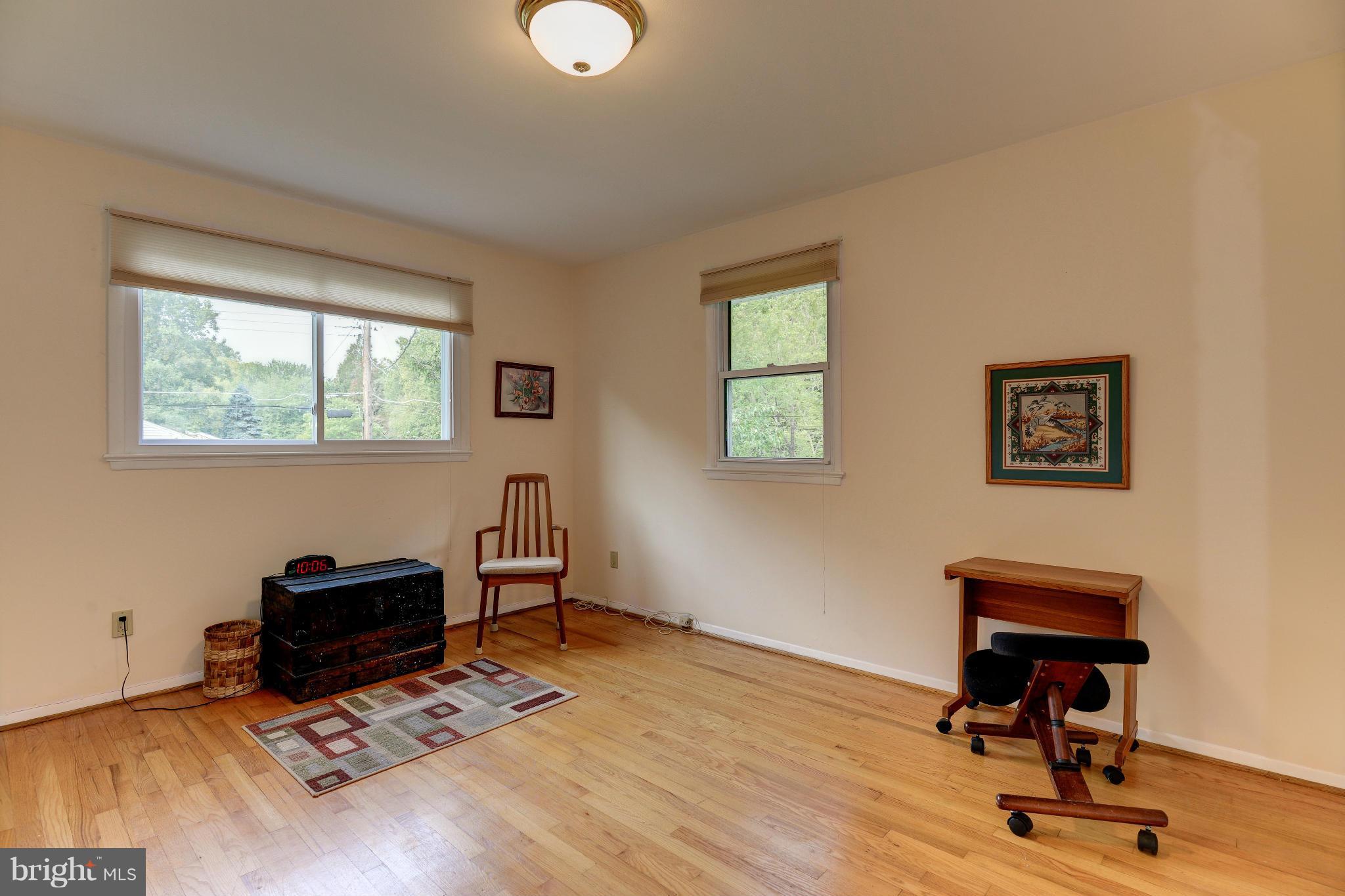 7522 Havelock Street Springfield, VA 22150 - Photo 19 of 30 a view of a workspace with furniture and a window