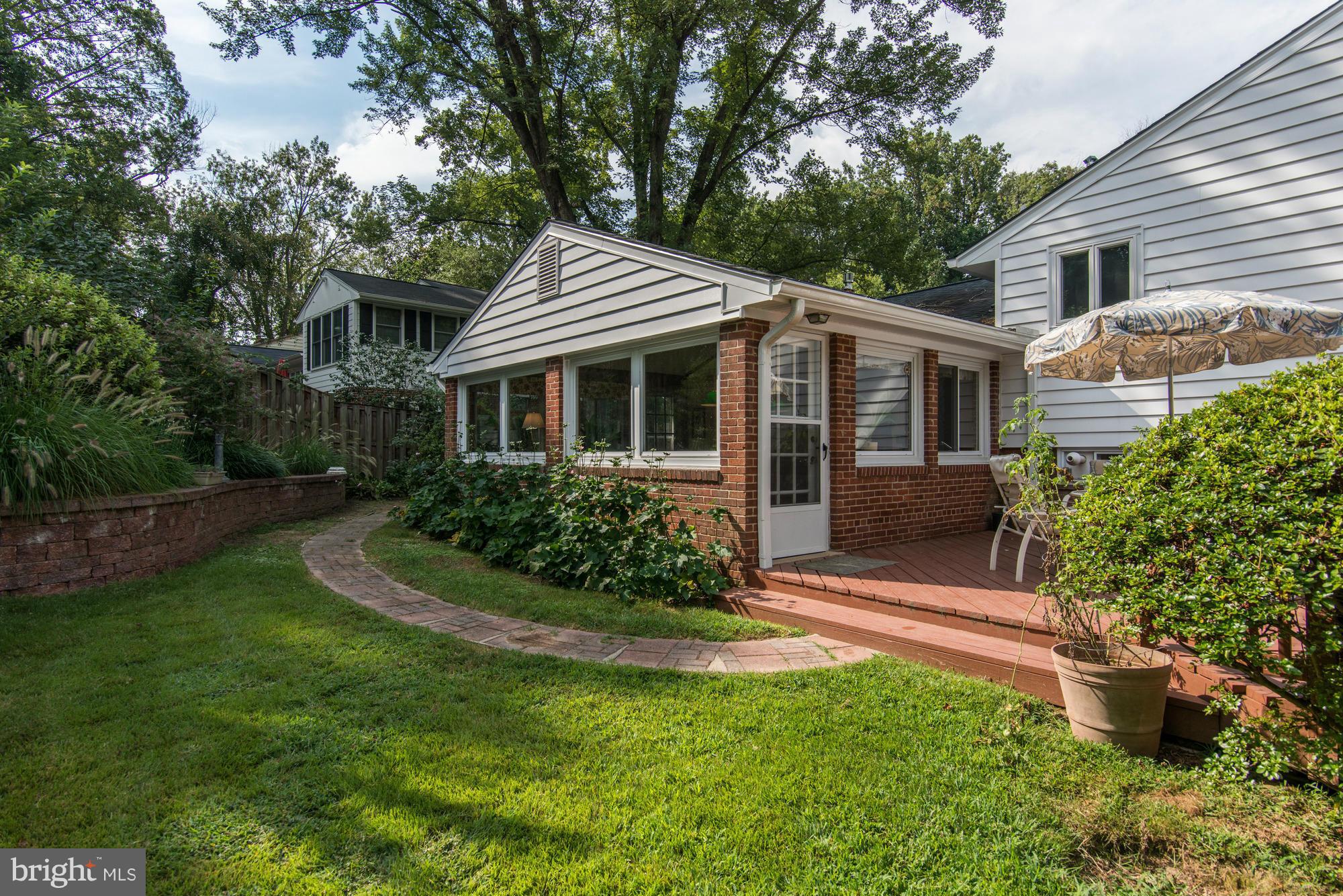 7522 Havelock Street Springfield, VA 22150 - Photo 25 of 30 a front view of house with yard and green space