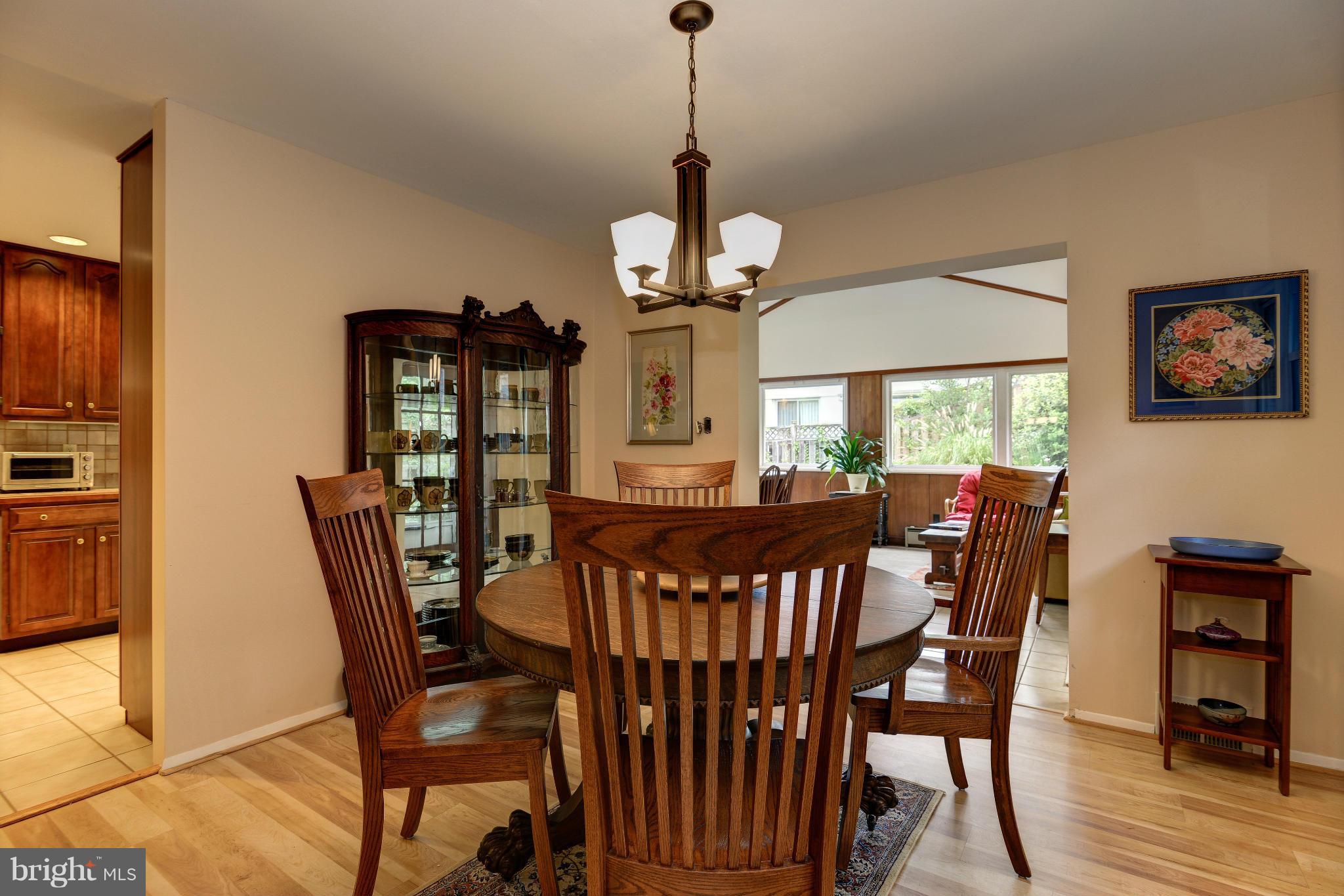 7522 Havelock Street Springfield, VA 22150 - Photo 8 of 30 a view of a dining room with furniture window and wooden floor