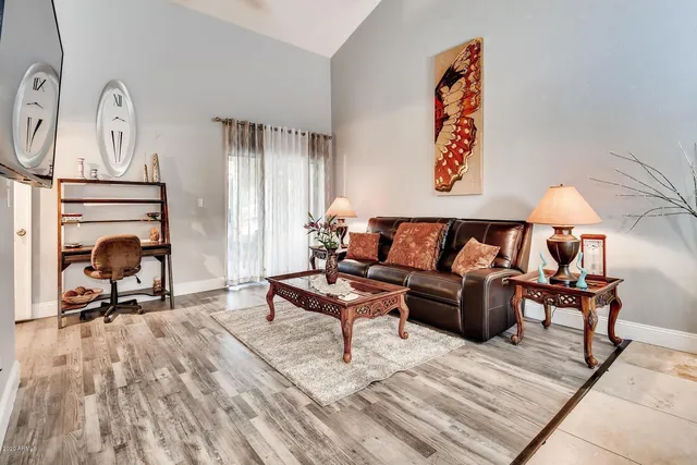 a living room with furniture and a fireplace