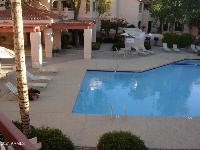 a view of a patio with couches and potted plants