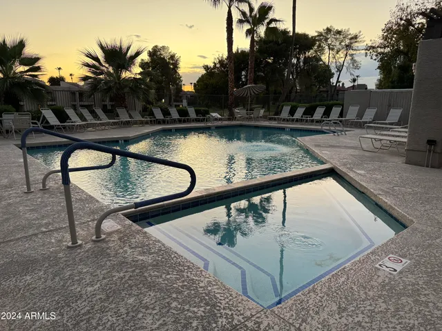 a view of a swimming pool with a patio