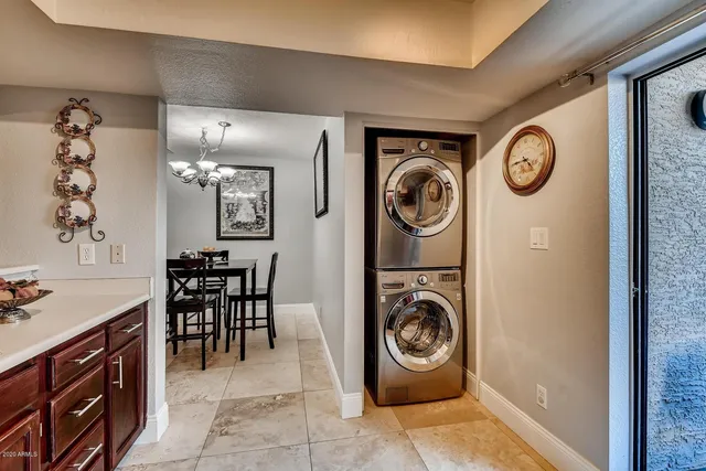 a view of a storage and utility room with washer and dryer