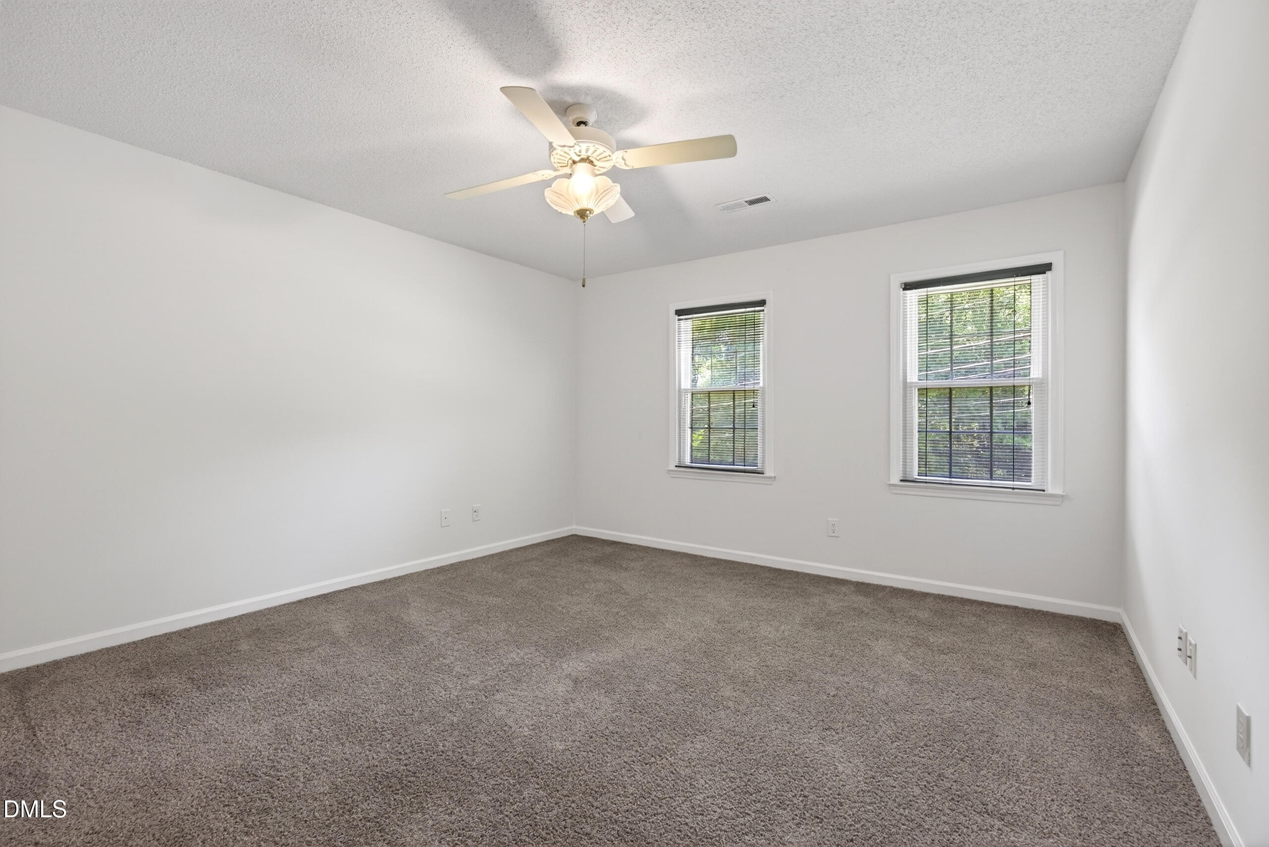 1901 Whites Mill Road High Point, NC 27265 - Photo 16 of 24 an empty room with windows and fan