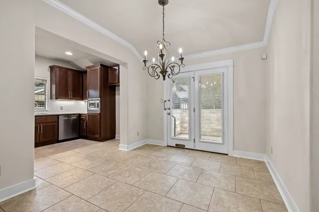 a view of a kitchen with a sink and dishwasher cabinets