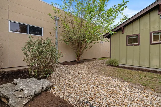 a backyard of a house with lots of green space