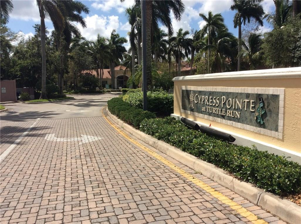 6498 West Sample Road, Unit 6498 Coral Springs, FL 33067 - Photo 11 of 19 a view of a sign board