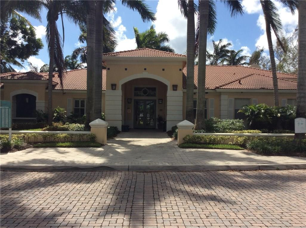6498 West Sample Road, Unit 6498 Coral Springs, FL 33067 - Photo 14 of 19 a view of a house with a patio