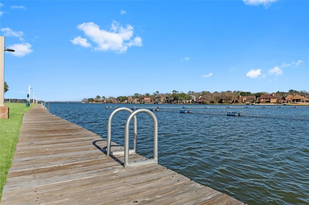 162 April Point Drive South Conroe, TX 77356 - Photo 21 of 26 Dock and ladder area, just a short walk from the unit.