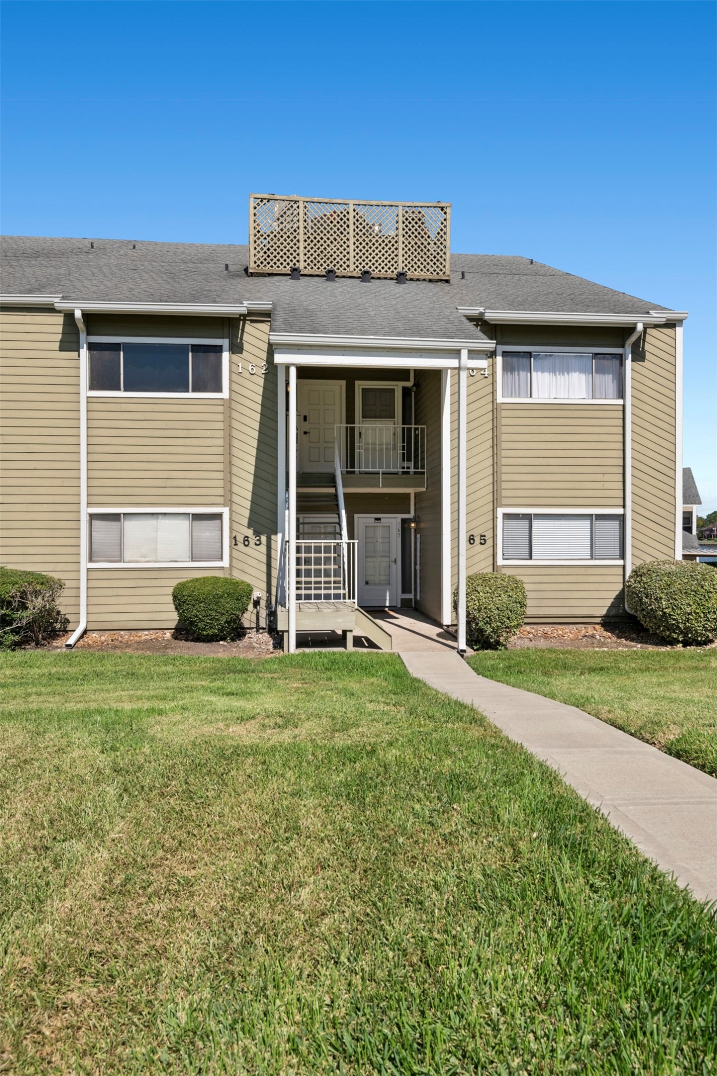 162 April Point Drive South Conroe, TX 77356 - Photo 22 of 26 Front exterior of unit