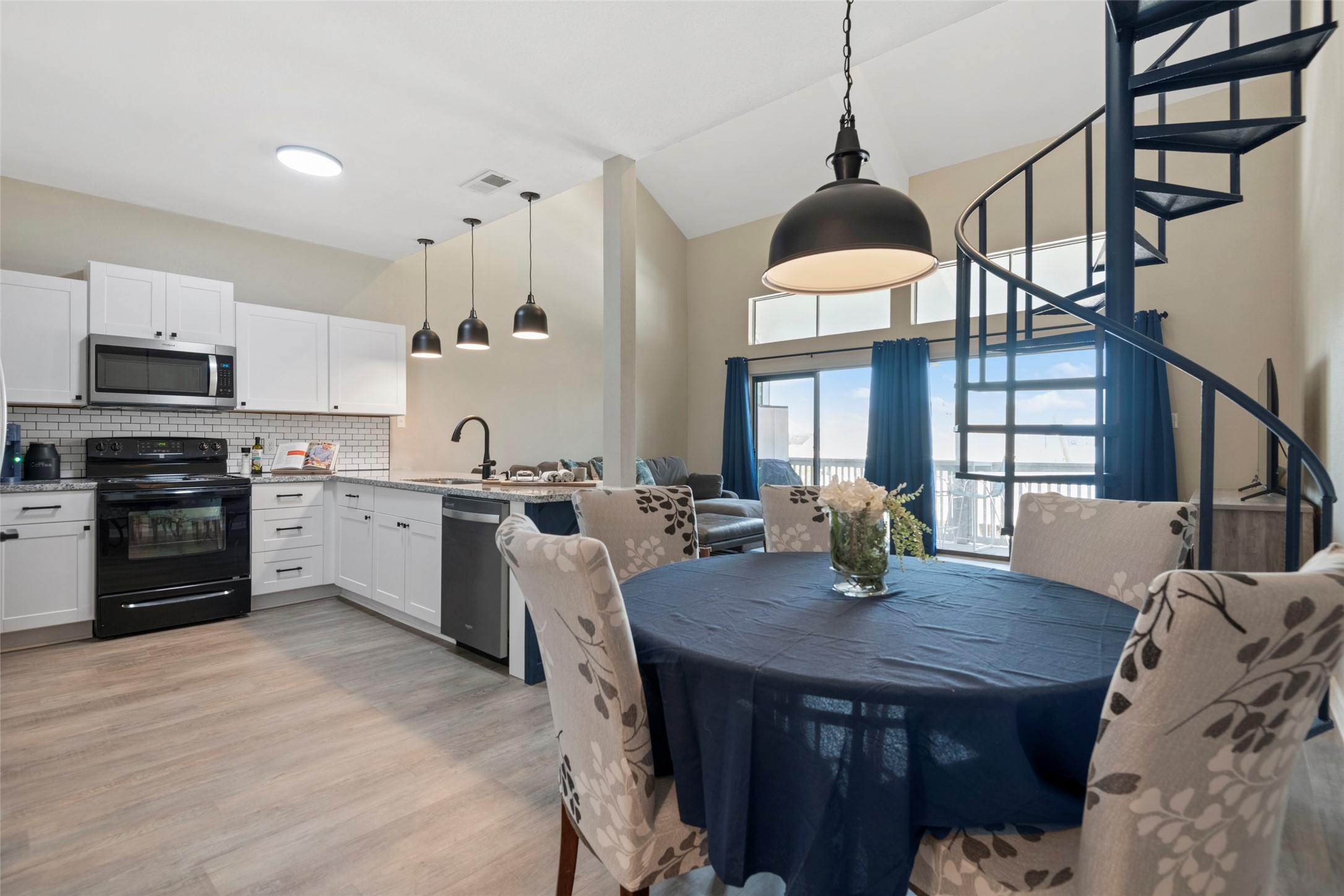 162 April Point Drive South Conroe, TX 77356 - Photo 5 of 26 Kitchen looks out into living area, and you can see the lake.