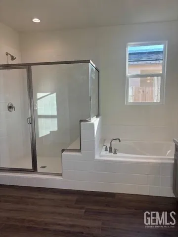 a bathroom with a bathtub and a sink