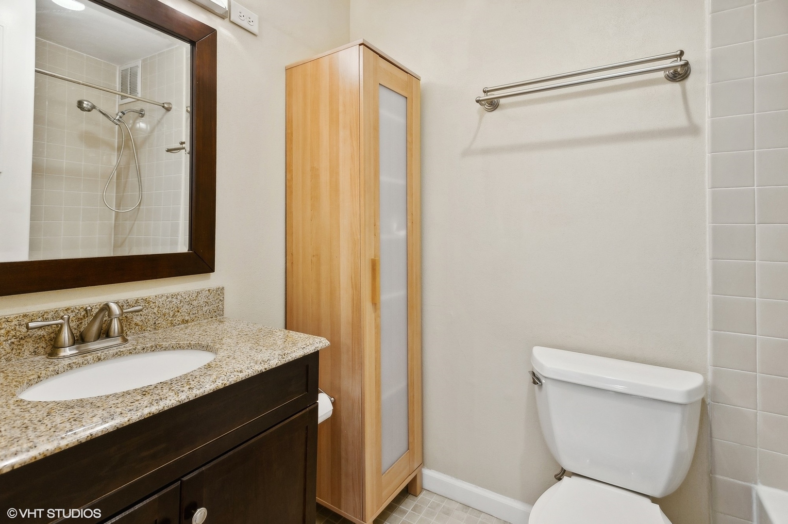 1 East Scott Street, Unit 1006 Chicago, IL 60610 - Photo 11 of 15 a bathroom with a granite countertop sink toilet and shower