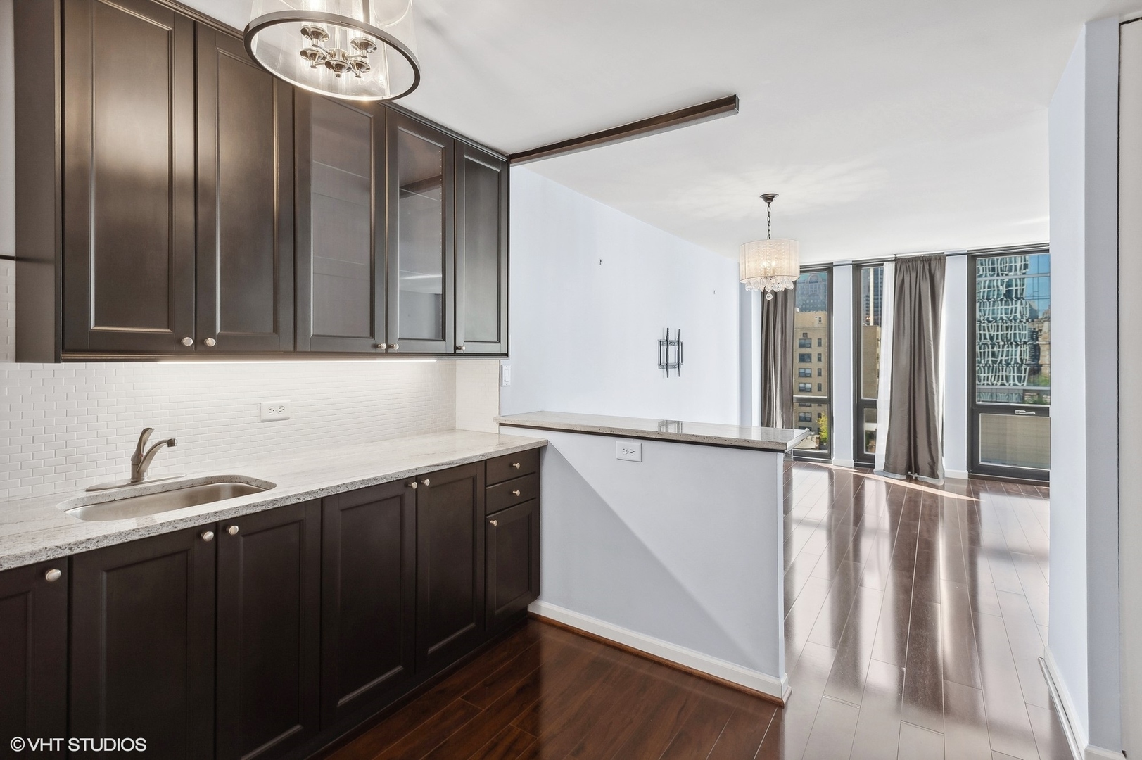 1 East Scott Street, Unit 1006 Chicago, IL 60610 - Photo 8 of 15 a kitchen with a sink and cabinets