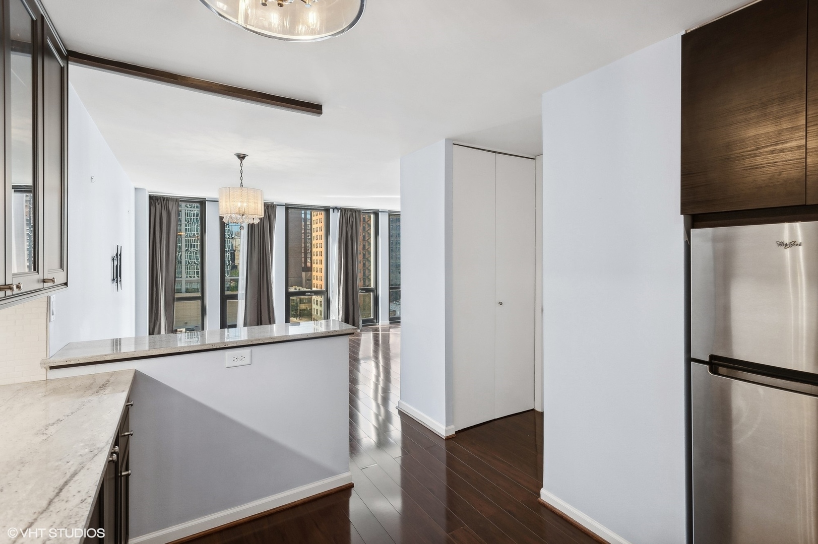 1 East Scott Street, Unit 1006 Chicago, IL 60610 - Photo 9 of 15 a view of a living room with a large window