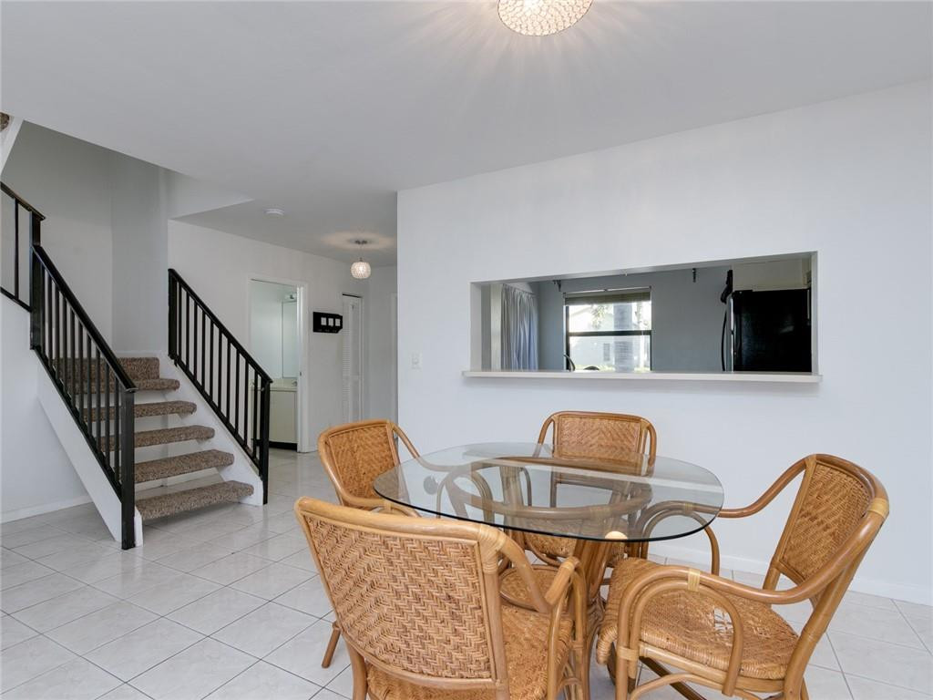 9112 Southwest 21st Court, Unit F Boca Raton, FL 33428 - Photo 13 of 34 a living room with furniture and a flat screen tv
