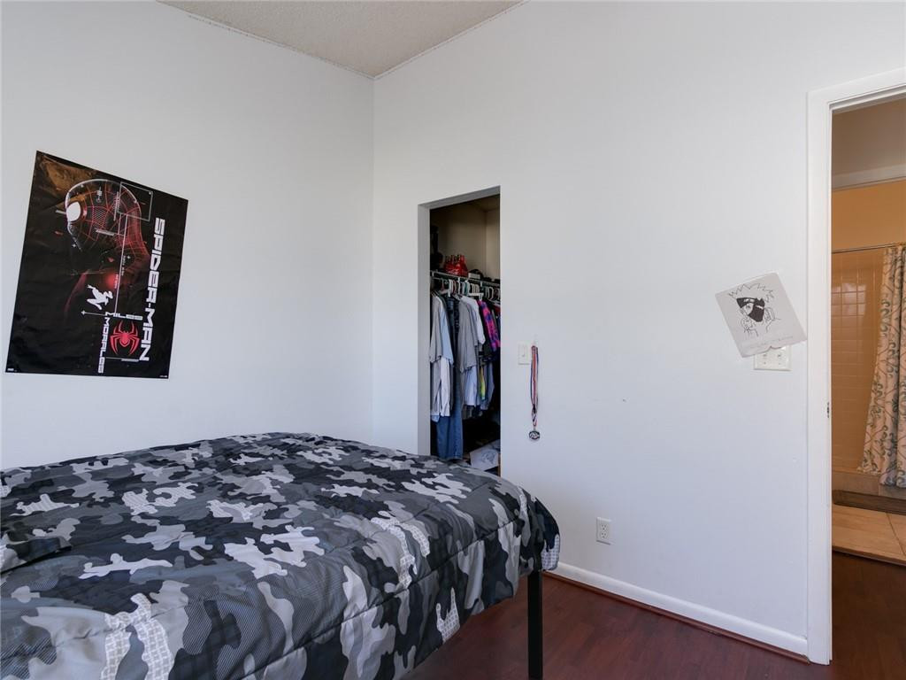 9112 Southwest 21st Court, Unit F Boca Raton, FL 33428 - Photo 24 of 34 a bedroom with a bed and a window
