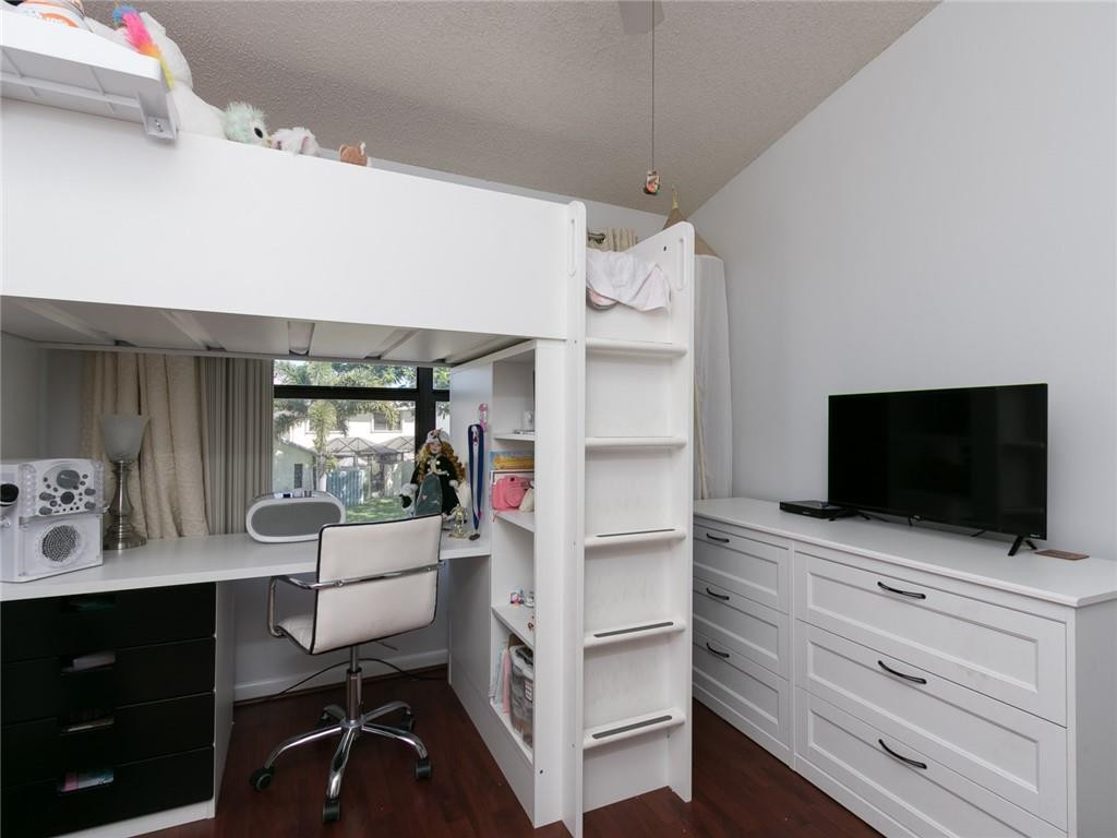 9112 Southwest 21st Court, Unit F Boca Raton, FL 33428 - Photo 27 of 34 a view of living room with furniture and flat screen tv