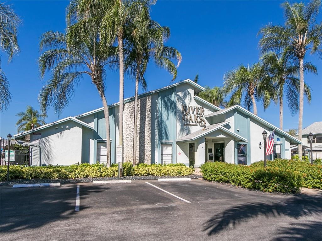 9112 Southwest 21st Court, Unit F Boca Raton, FL 33428 - Photo 29 of 34 front view of a house with a street
