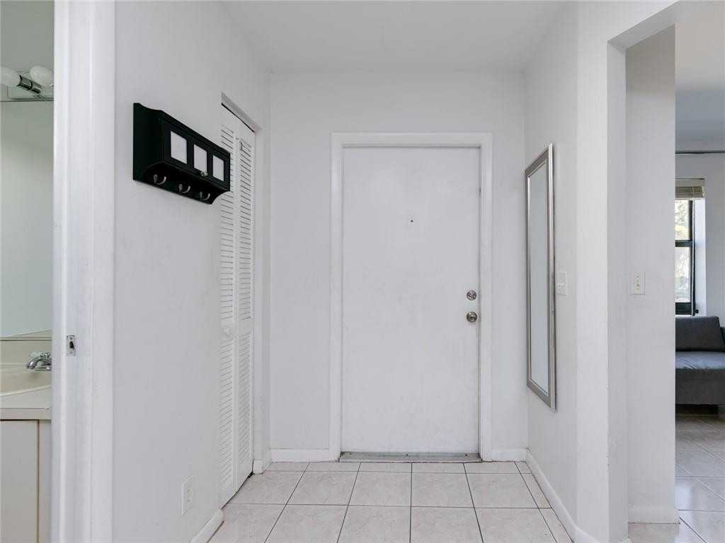9112 Southwest 21st Court, Unit F Boca Raton, FL 33428 - Photo 30 of 34 a view of a hallway with elevator