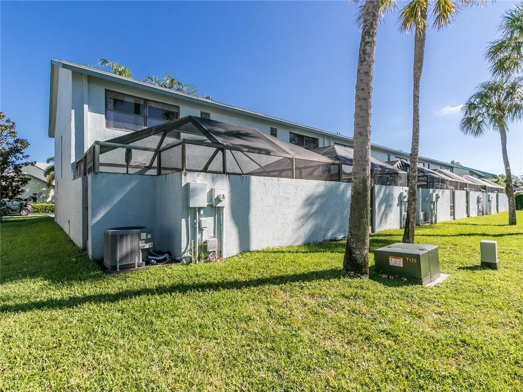 9112 Southwest 21st Court, Unit F Boca Raton, FL 33428 - Photo 34 of 34 a view of a house with a yard