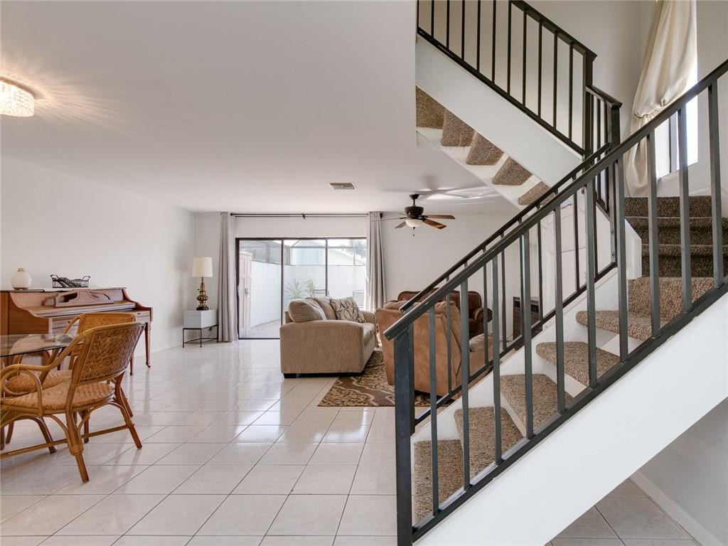9112 Southwest 21st Court, Unit F Boca Raton, FL 33428 - Photo 6 of 34 a view of entryway and hall with dining room