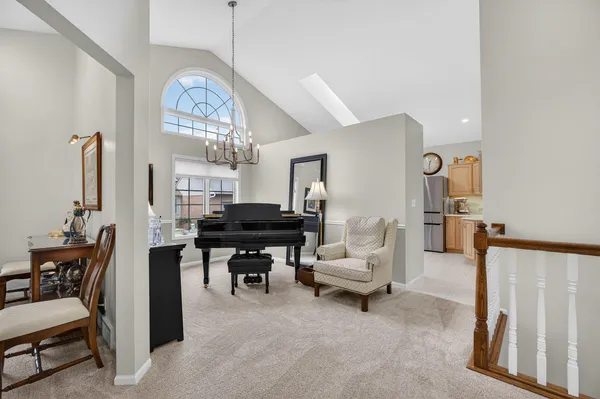 a view of a livingroom with furniture and a window