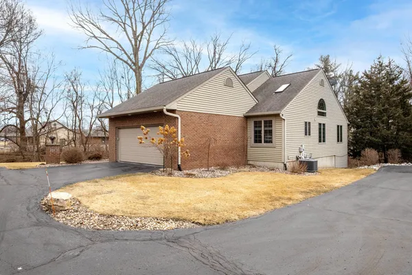 a view of a house with snow in the backyard