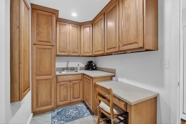 a kitchen with stainless steel appliances granite countertop a sink and cabinets
