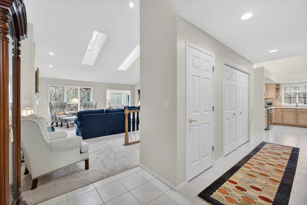 a living room with furniture and a rug