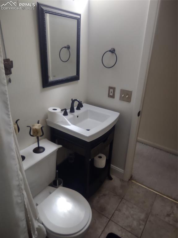 423 Ridge Road Divide, CO 80814 - Photo 18 of 48 a bathroom with a toilet sink and mirror