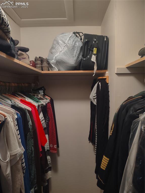 423 Ridge Road Divide, CO 80814 - Photo 26 of 48 a view of walk in closet with clothes and shoes