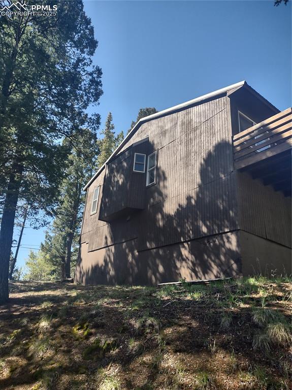 423 Ridge Road Divide, CO 80814 - Photo 3 of 48 a view of a house with a yard