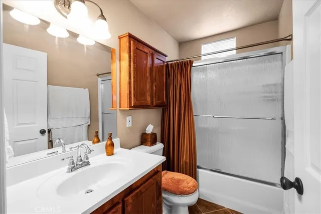 a bedroom with a bed and a lamp