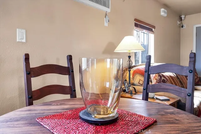 a view of hall way with furniture and rug