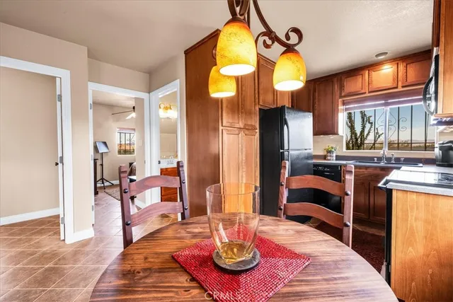 a kitchen with a stove a sink and a window