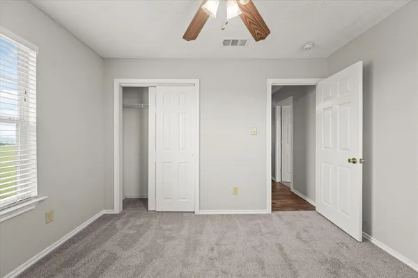 an empty room with cabinet