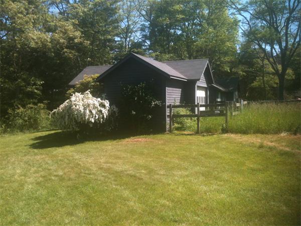 142 Roxy Cahoon Road Plymouth, MA 02360 - Photo 13 of 13 a front view of a house with a yard