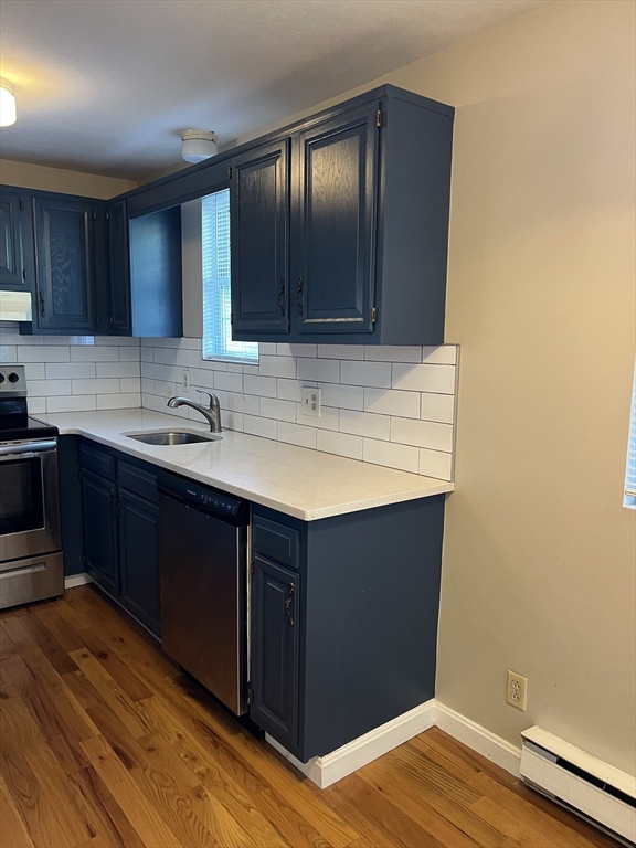 21 Bessom Street, Unit 6 Marblehead, MA 01945 - Photo 2 of 12 a kitchen with sink and cabinets