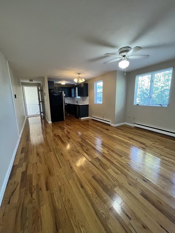 21 Bessom Street, Unit 6 Marblehead, MA 01945 - Photo 6 of 12 a view of empty room with wooden floor