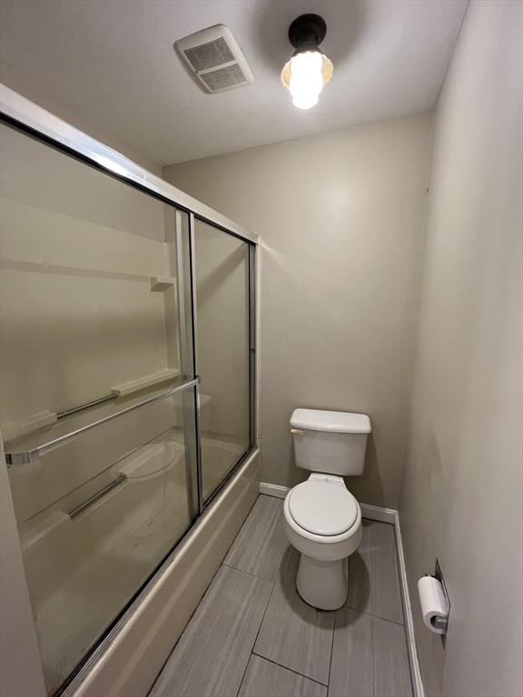 21 Bessom Street, Unit 6 Marblehead, MA 01945 - Photo 7 of 12 a bathroom with a toilet and a shower