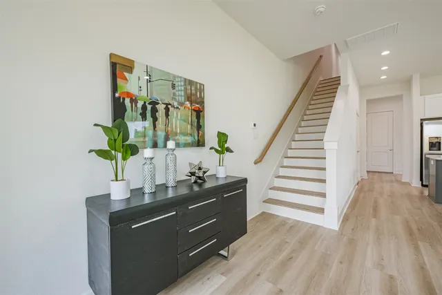 a white bath tub sitting in a bathroom and shower