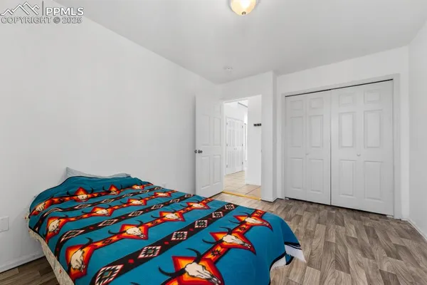 a bedroom with a bed and a dresser