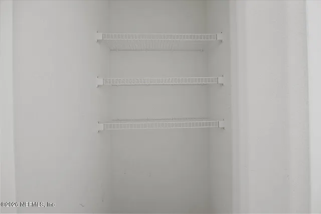 a view of an empty walk in closet