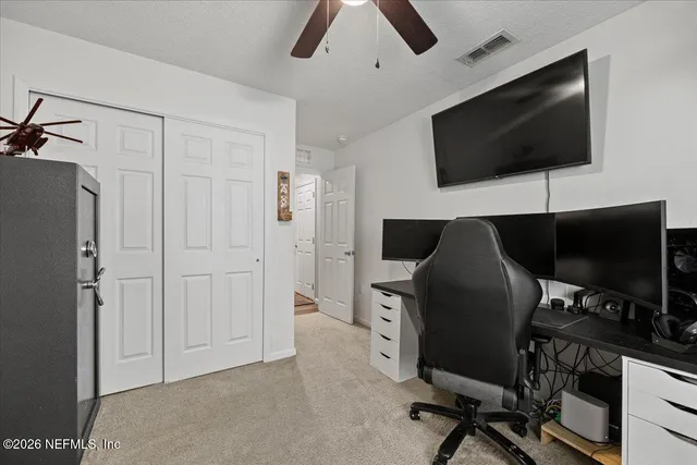a view of a livingroom with furniture and a flat screen tv
